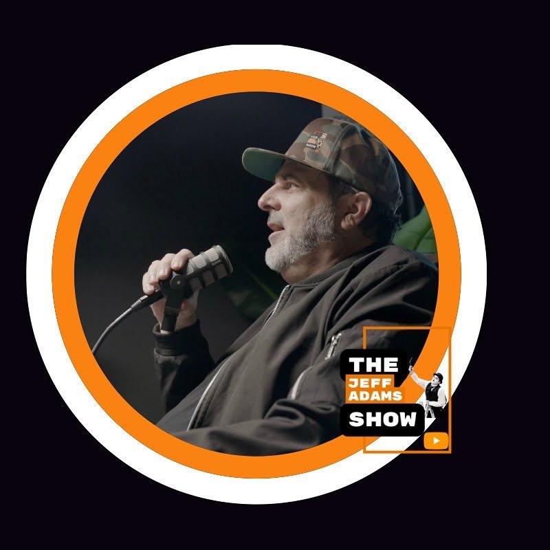 Jeff Adams recording the podcast on the microphone